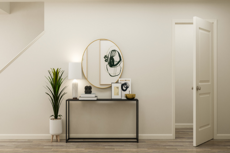 A room with a table and a mirror.