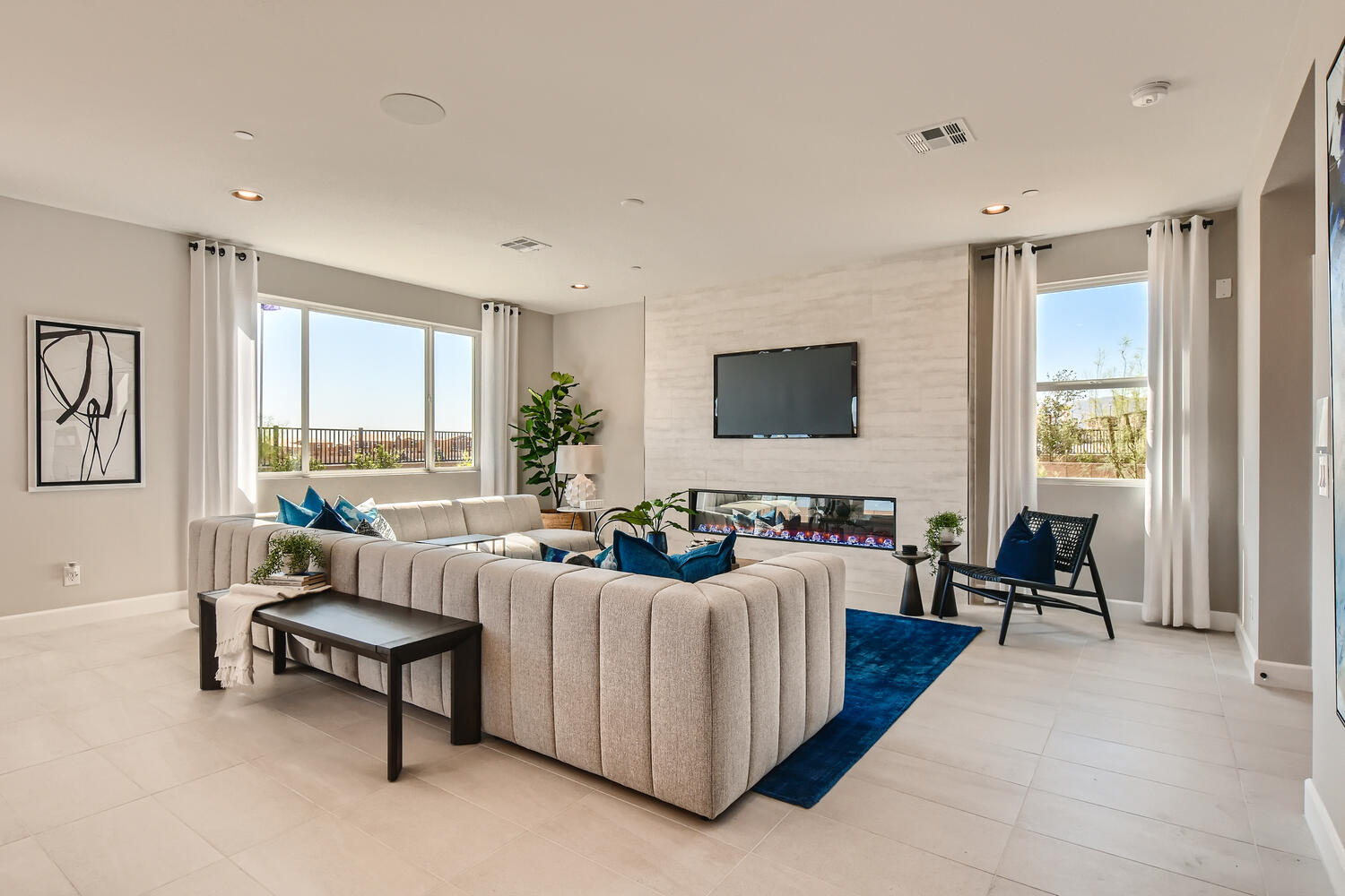 A living room with a tv and couches.