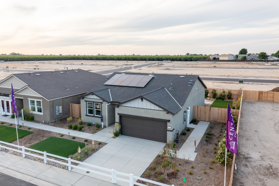 A house with a fence around it.