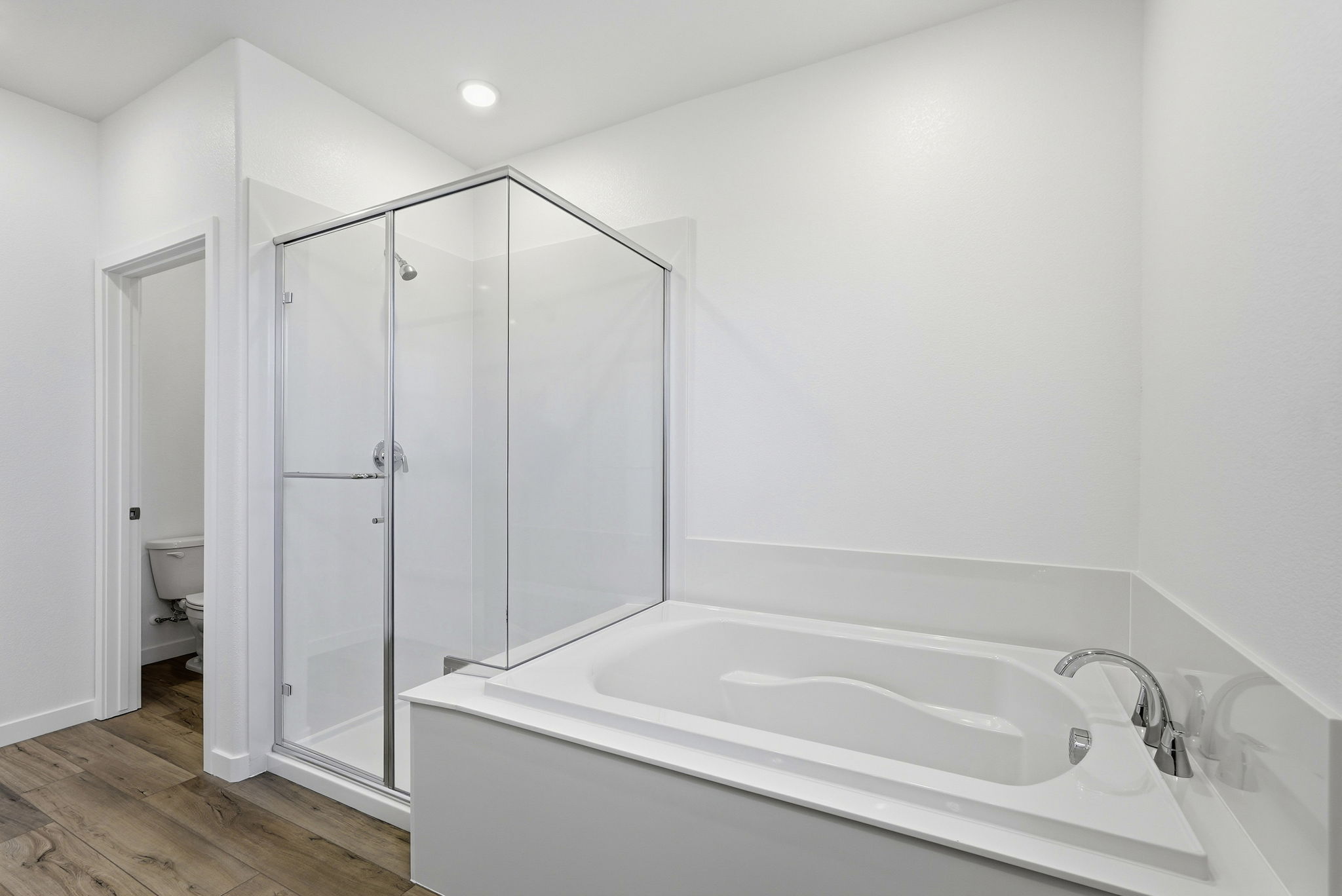 A bathroom with a glass shower.