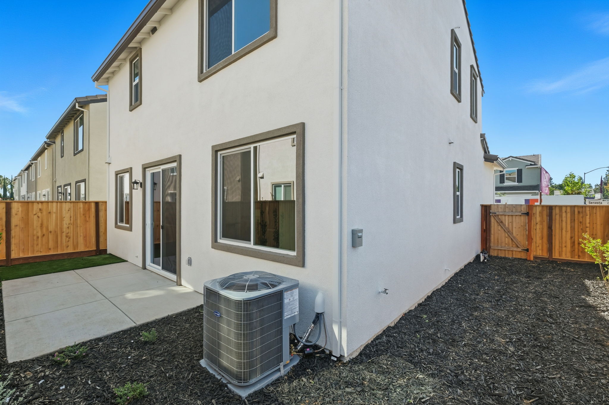 A white house with a fence.