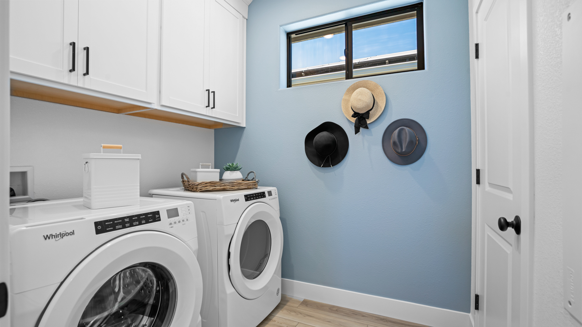 A laundry room with a washer and dryer.