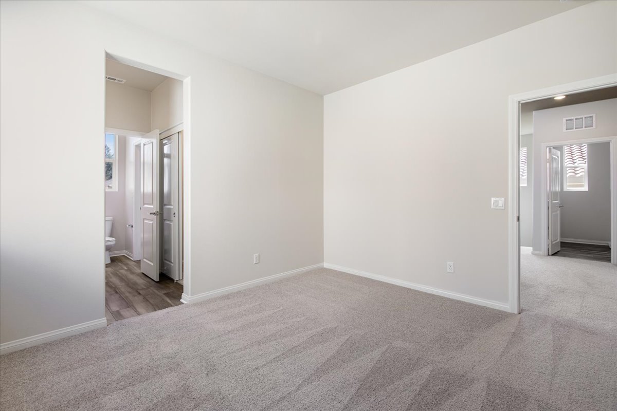 A hallway with white walls.