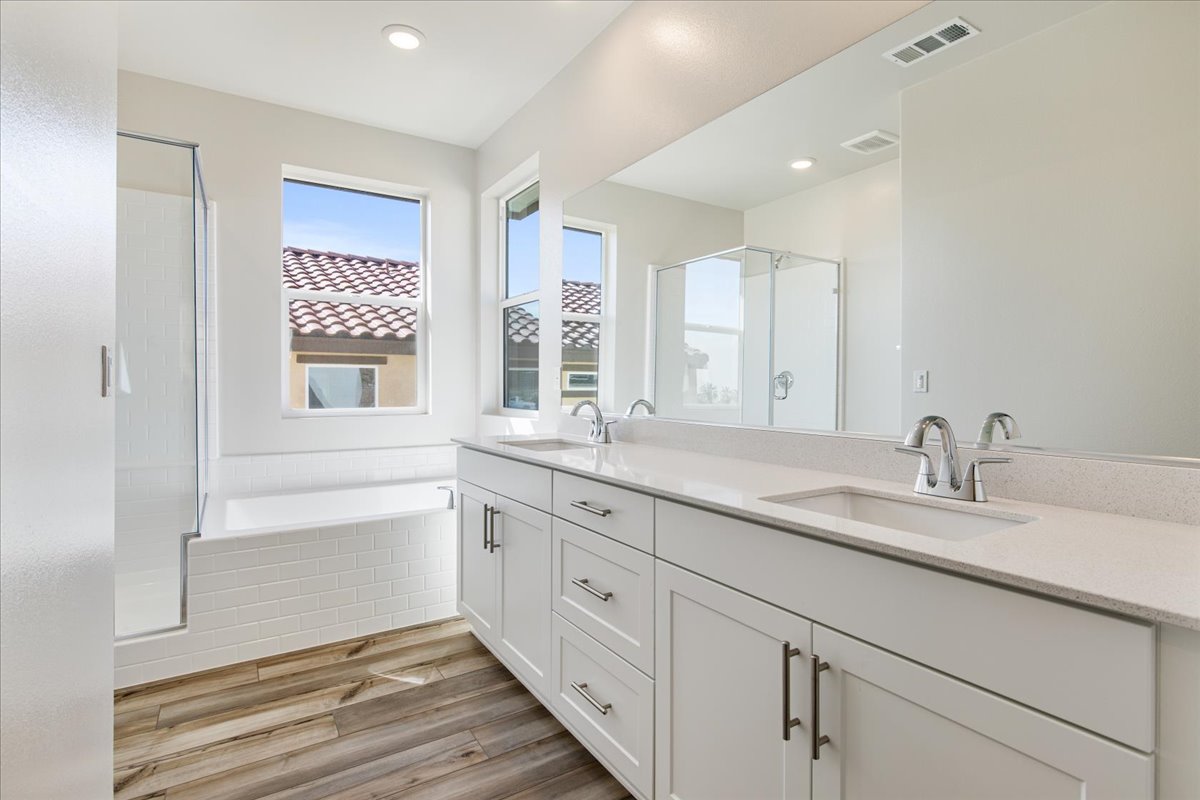 A bathroom with a large mirror.