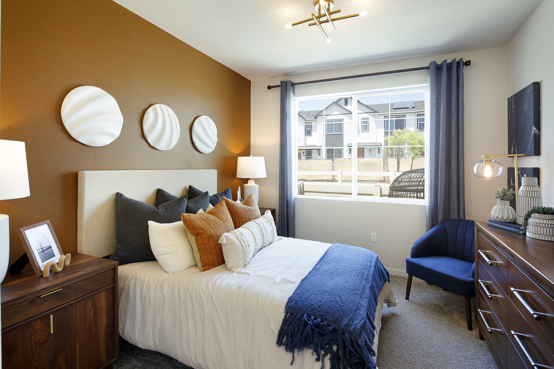 A bedroom with a bed and a window.