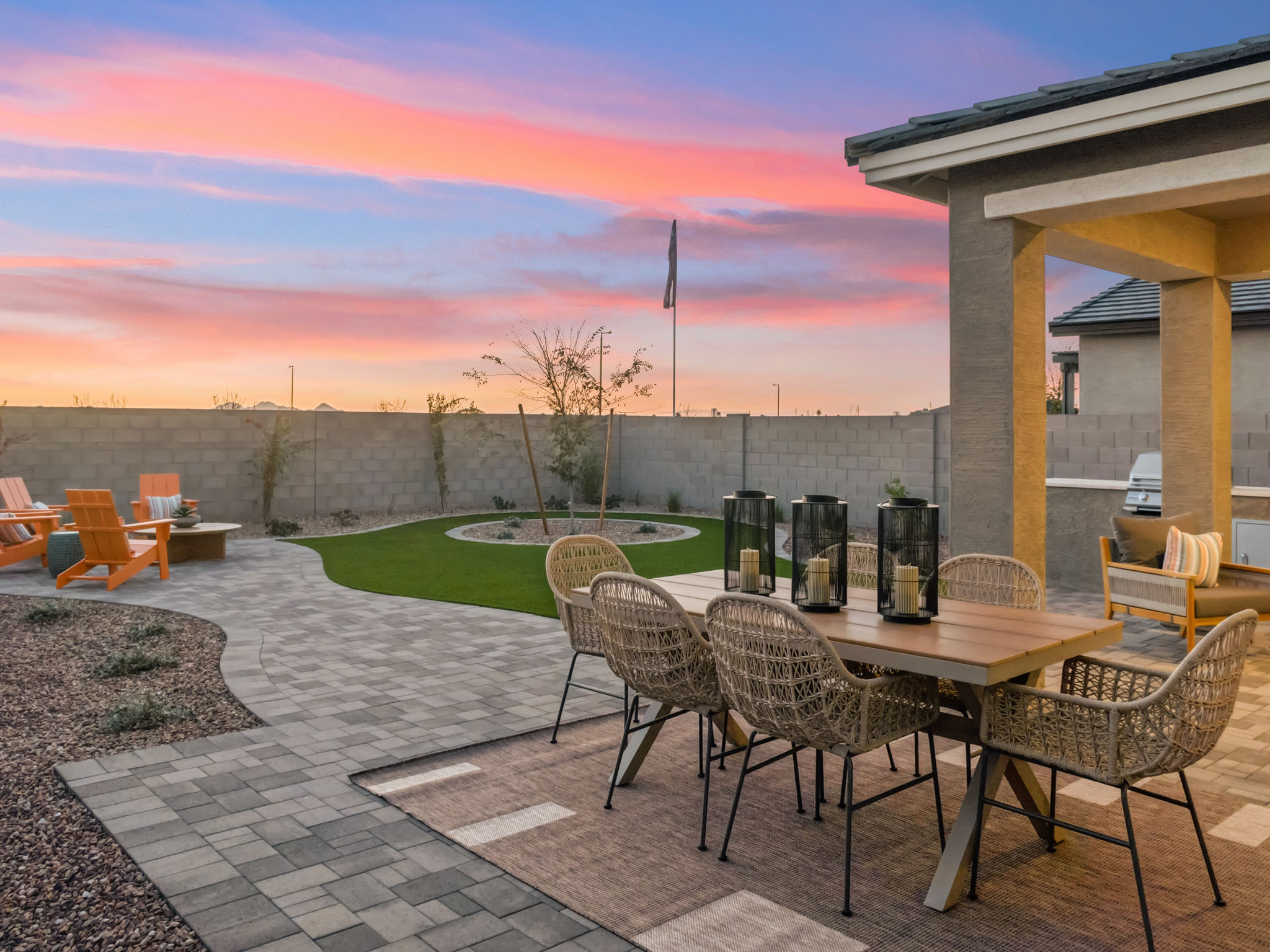 A patio with a table and chairs.
