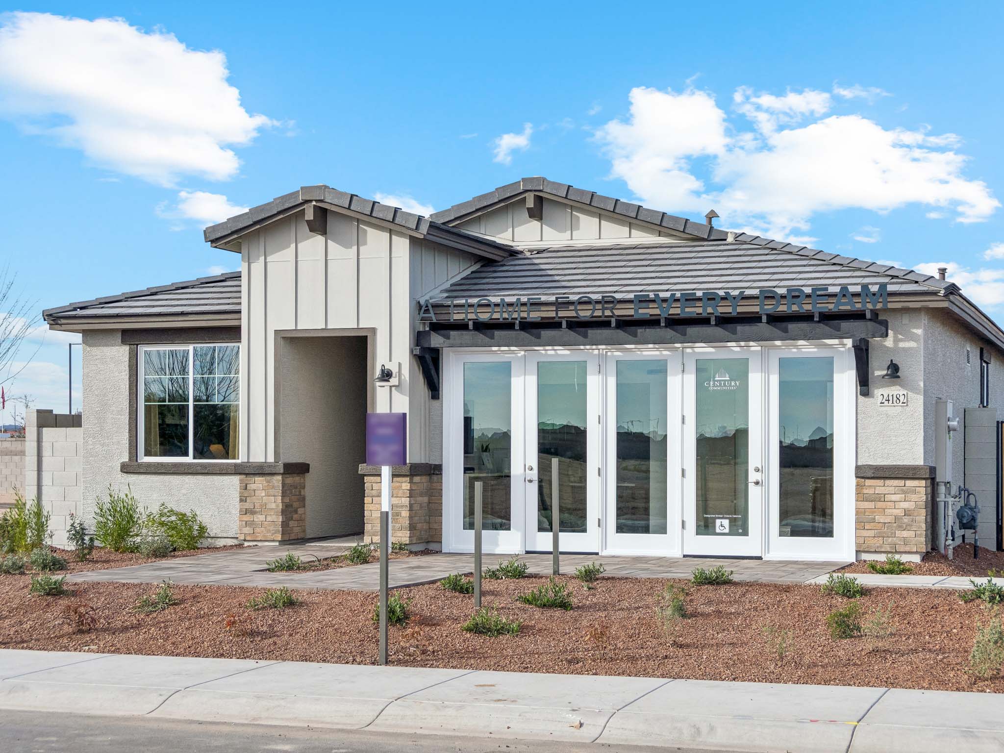 A building with a sign in front.