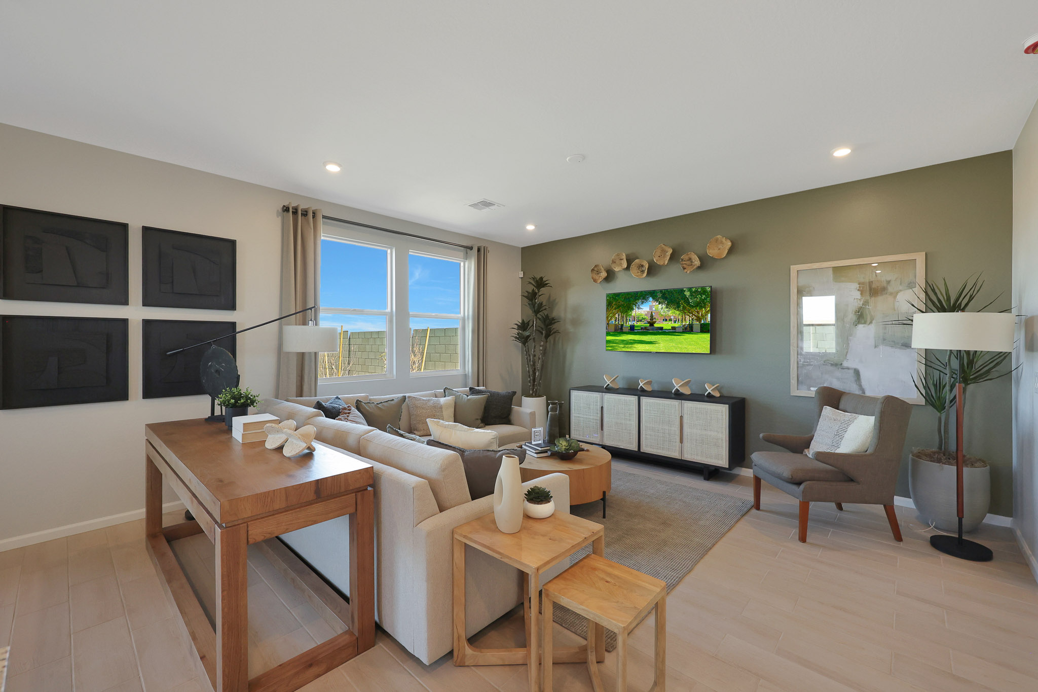 A living room with a large tv.