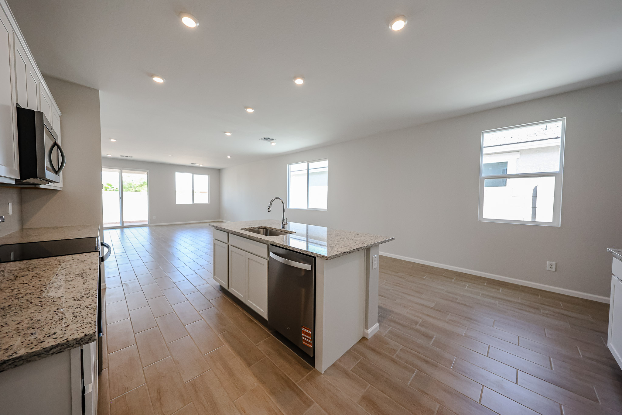 A kitchen with wooden floors.