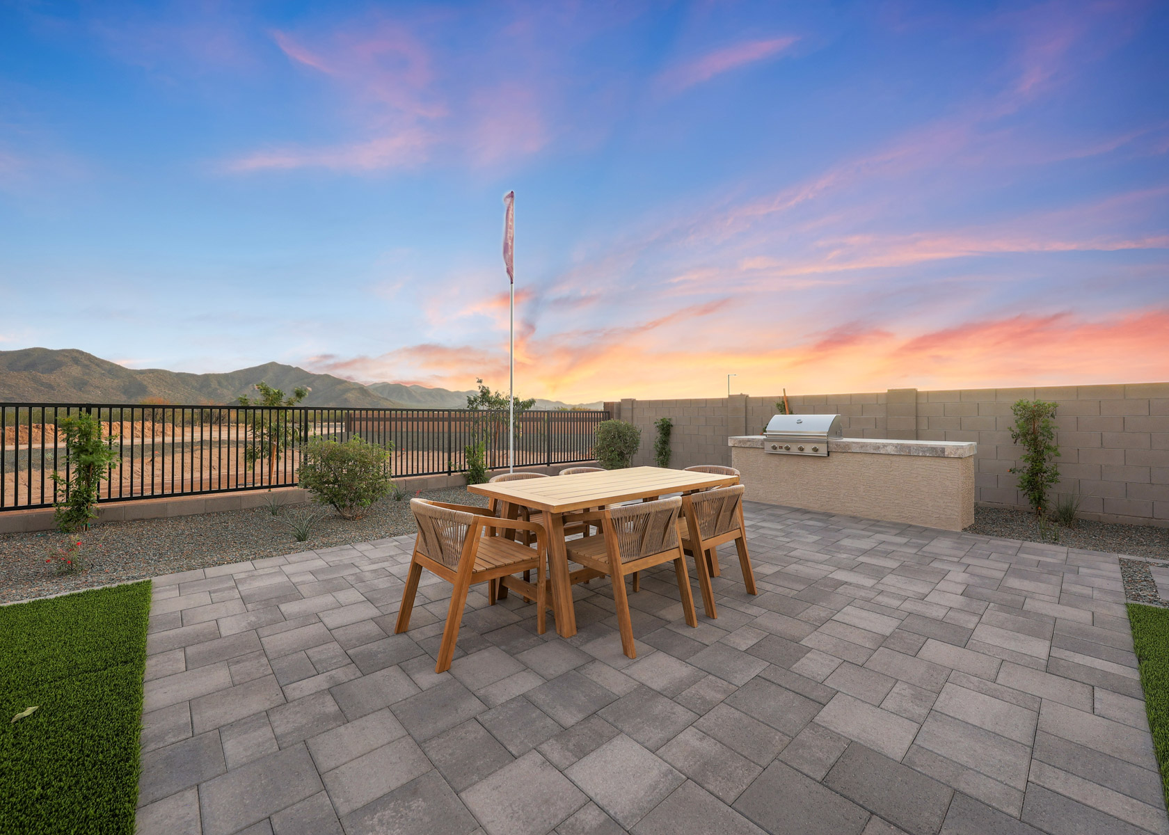 A table and chairs on a patio.