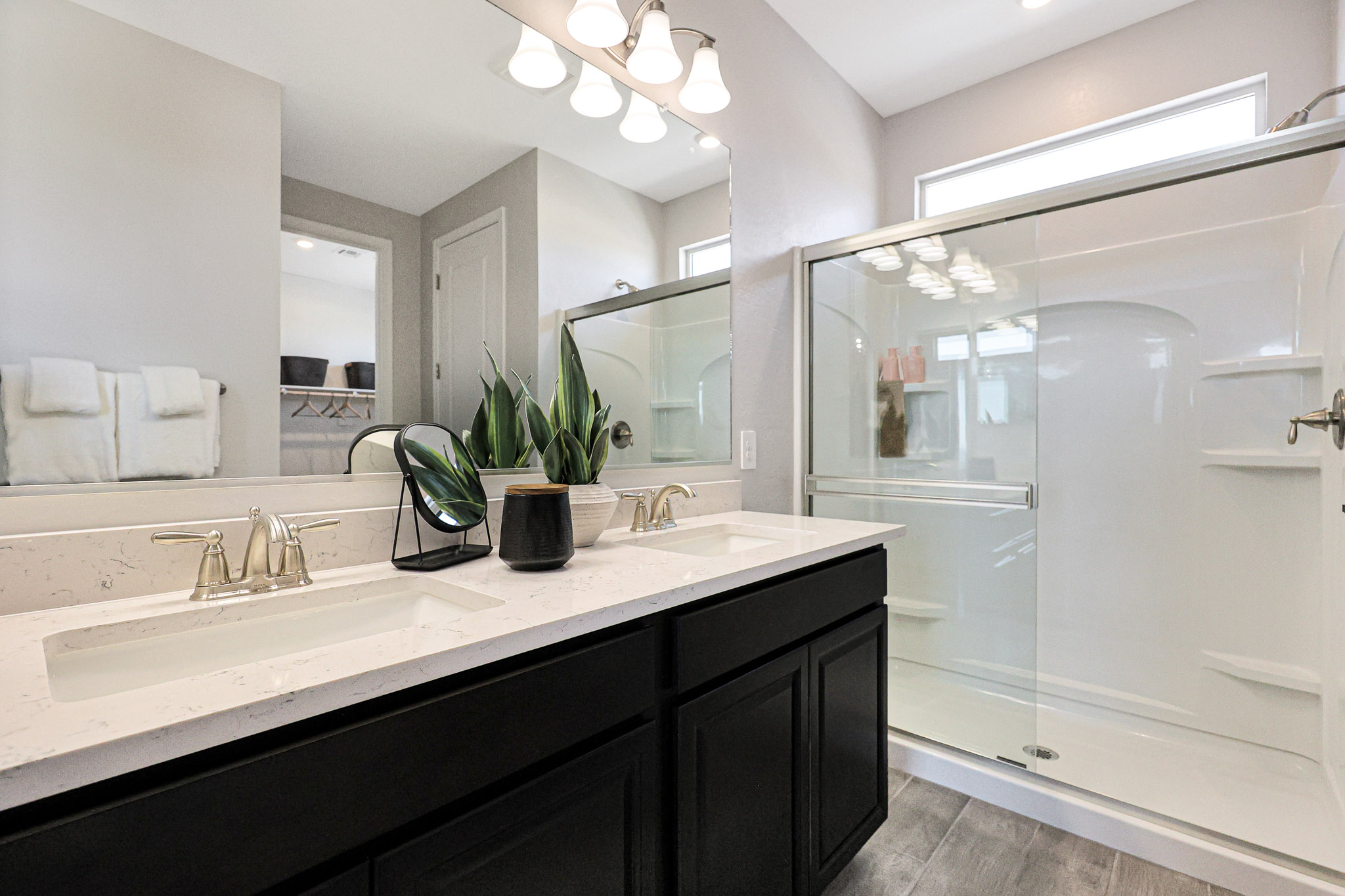 A bathroom with a glass shower.