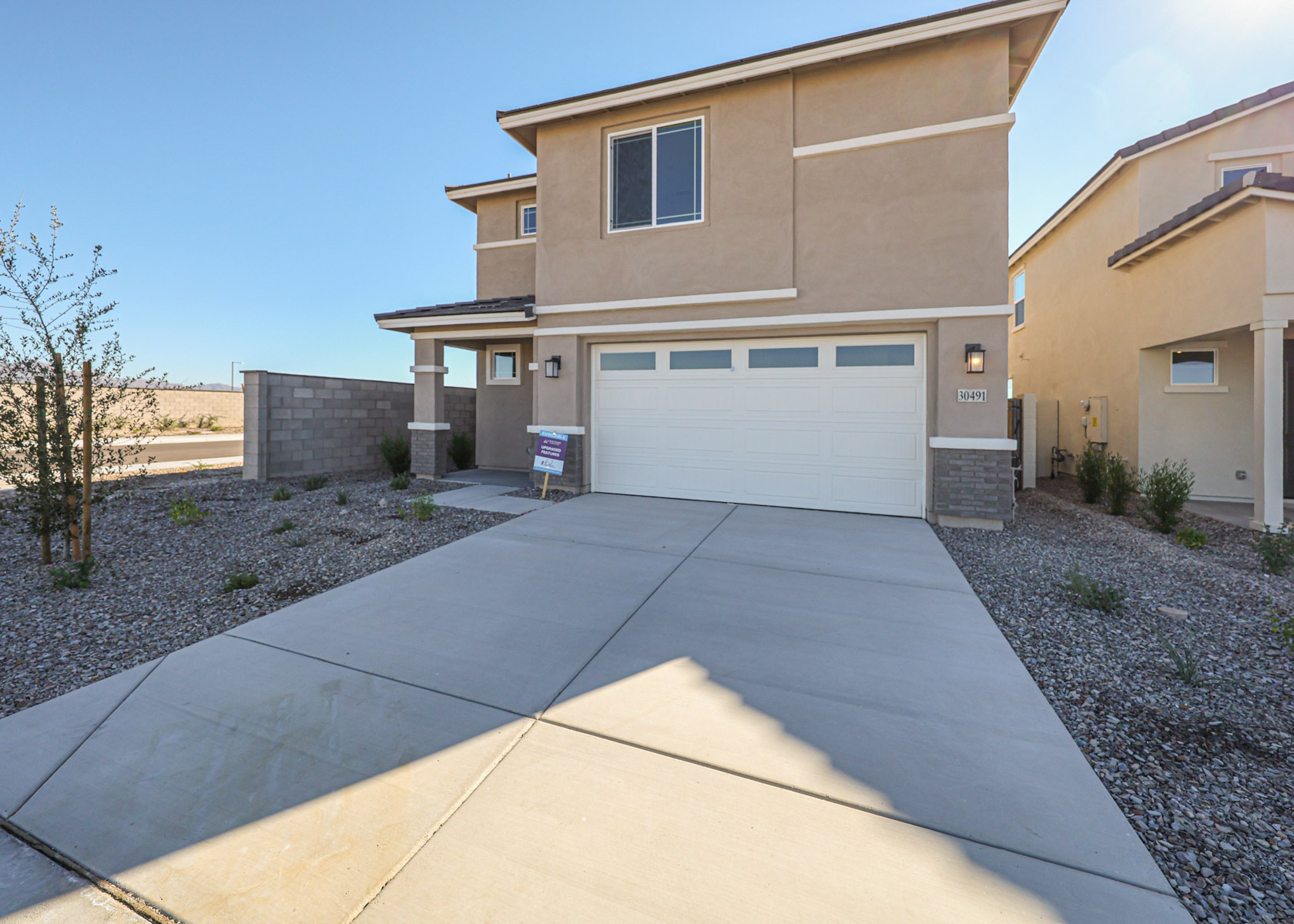 A driveway leading to a building.