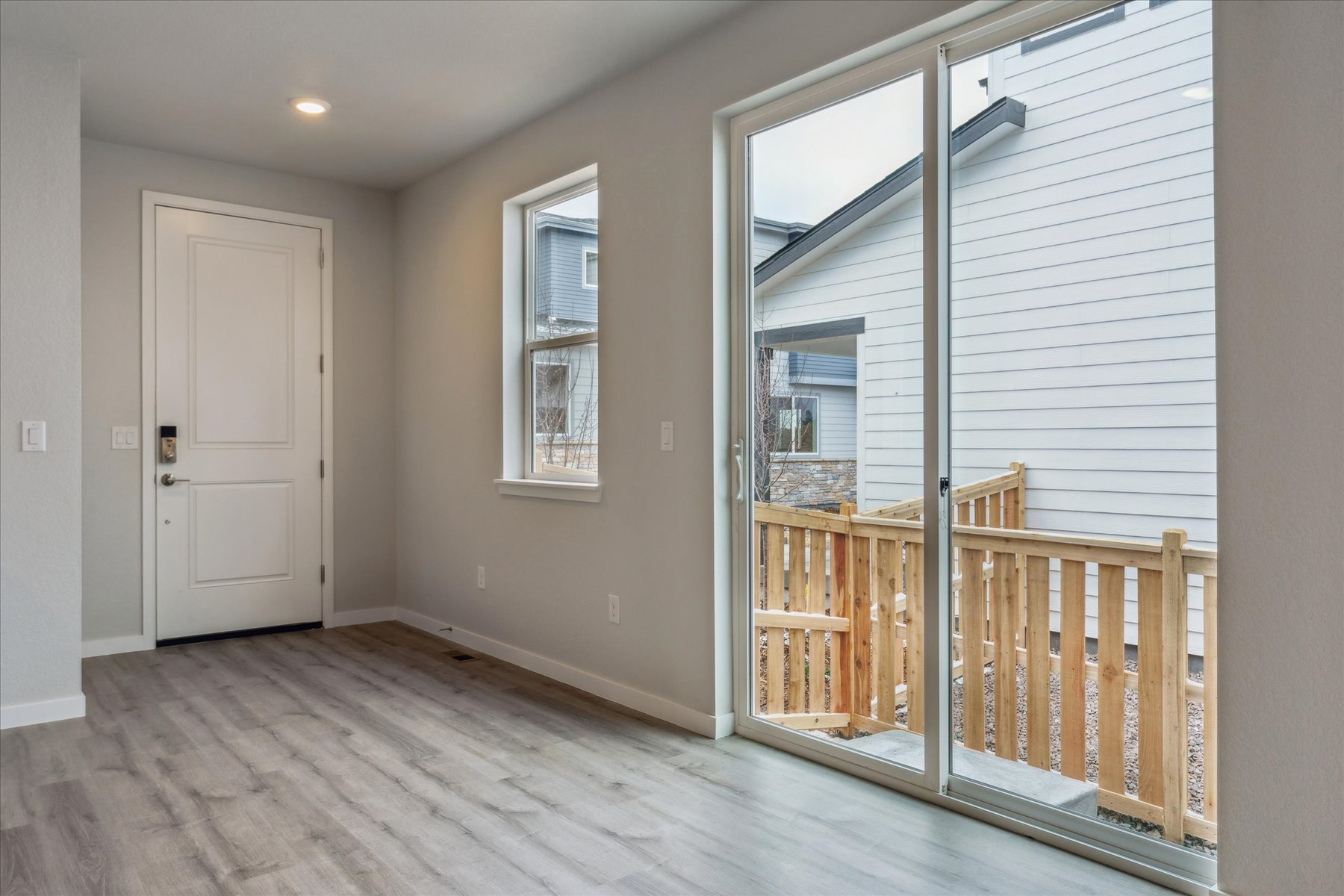 A room with a wood railing and a wood railing.