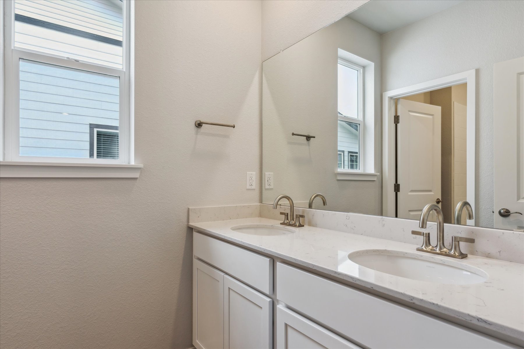 A bathroom with two sinks.