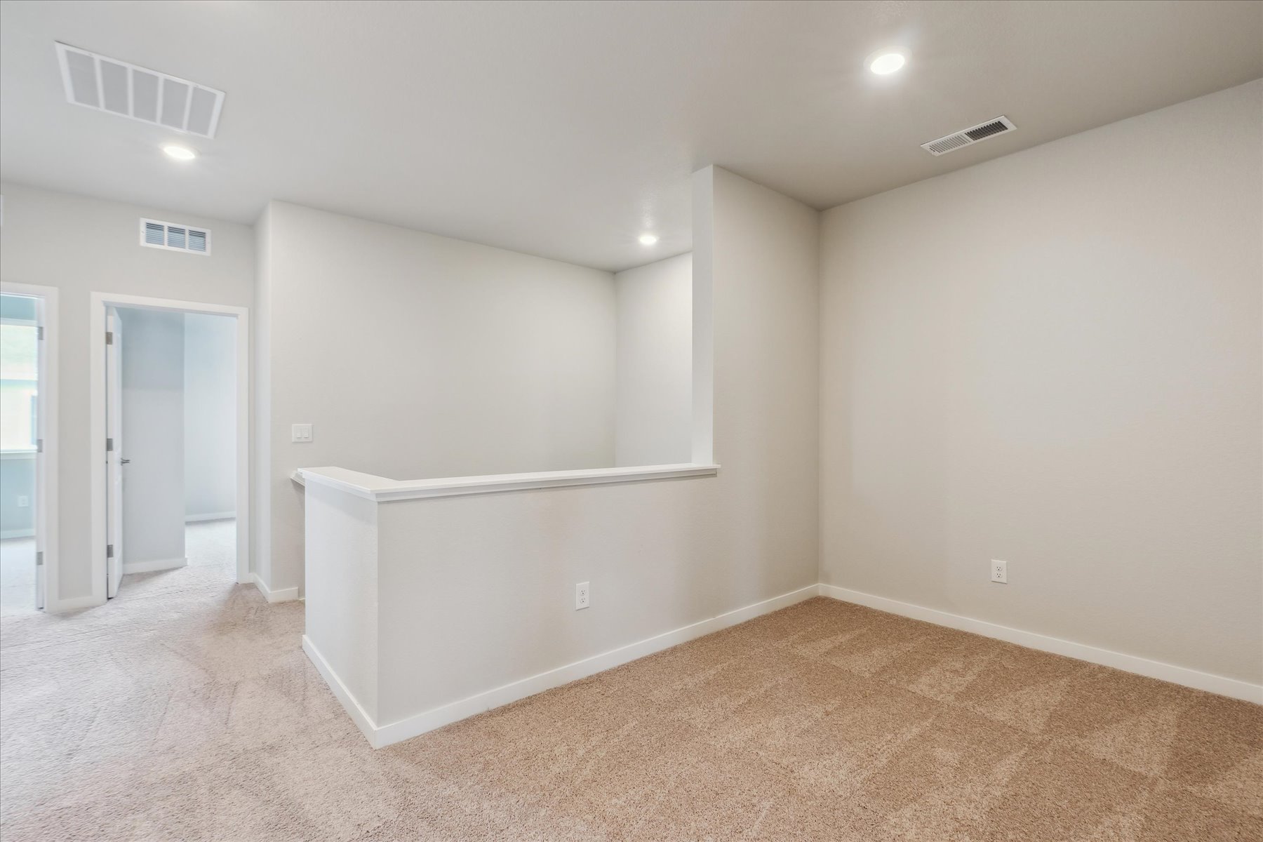 A room with a white wall and a white floor.