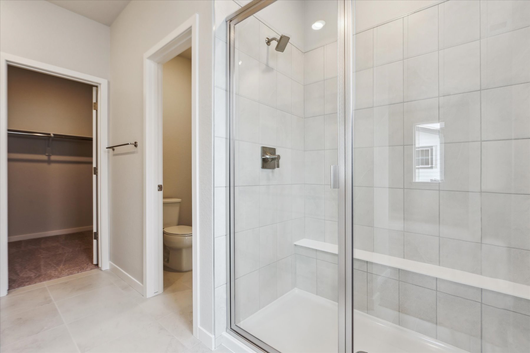 A bathroom with a glass shower.