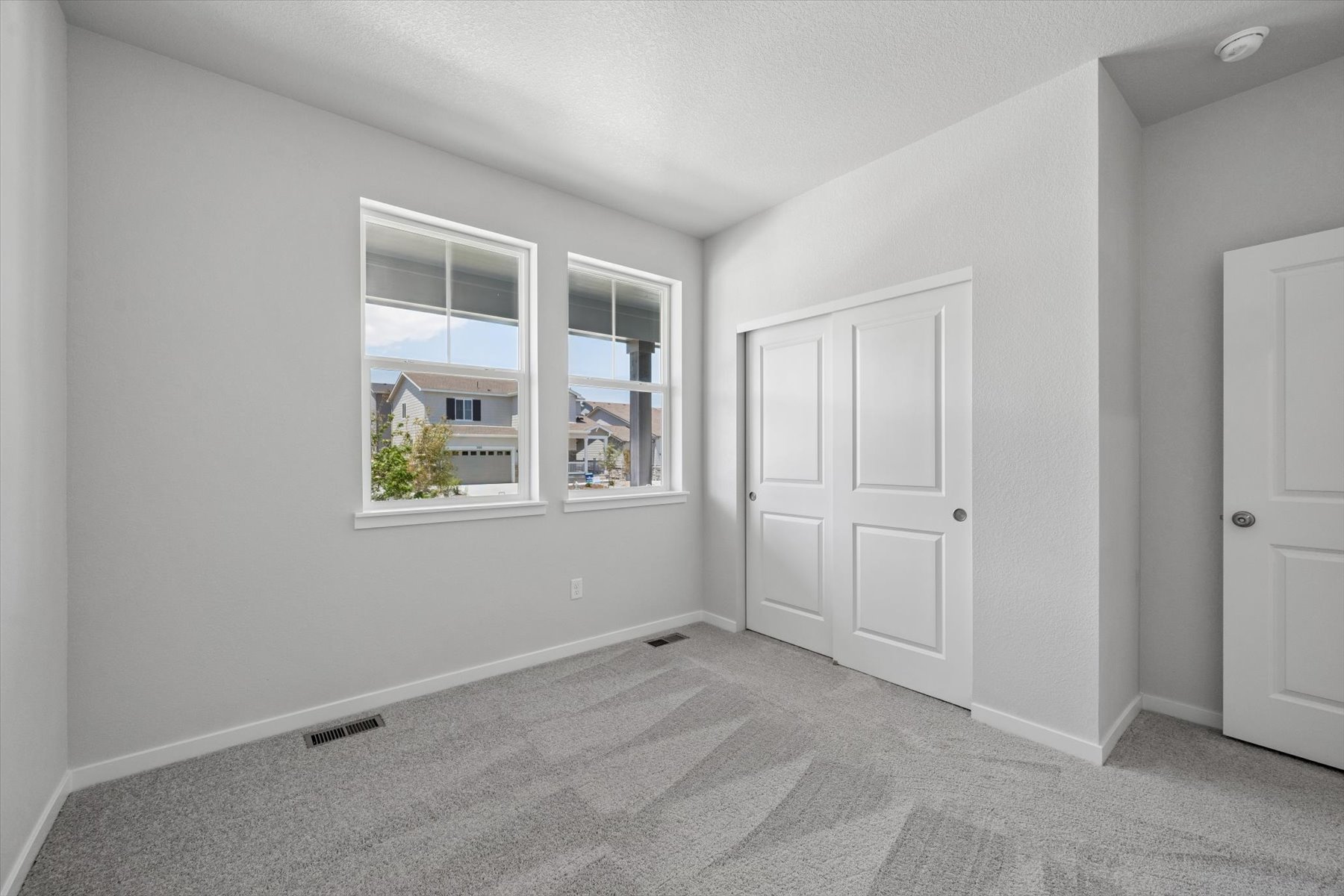 A room with white doors.