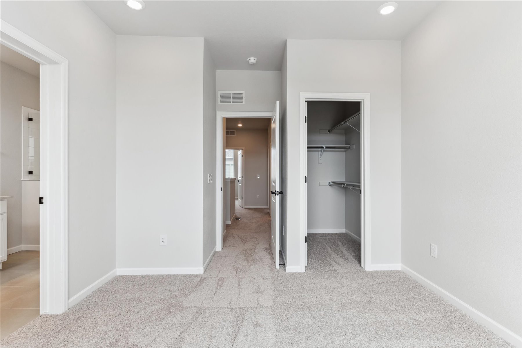A hallway with white walls.