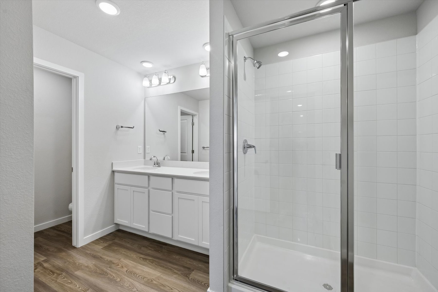 A bathroom with a glass shower.