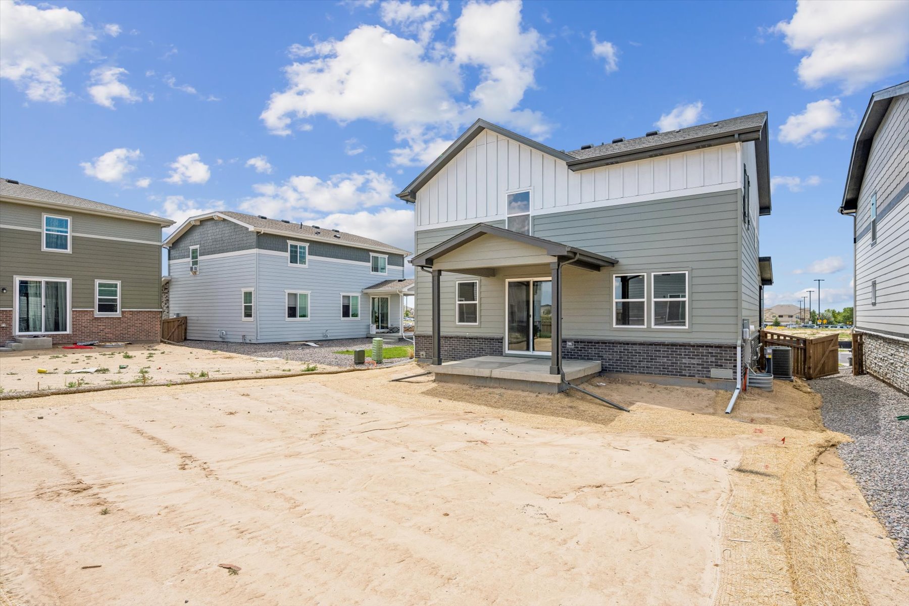 A building with a dirt road.