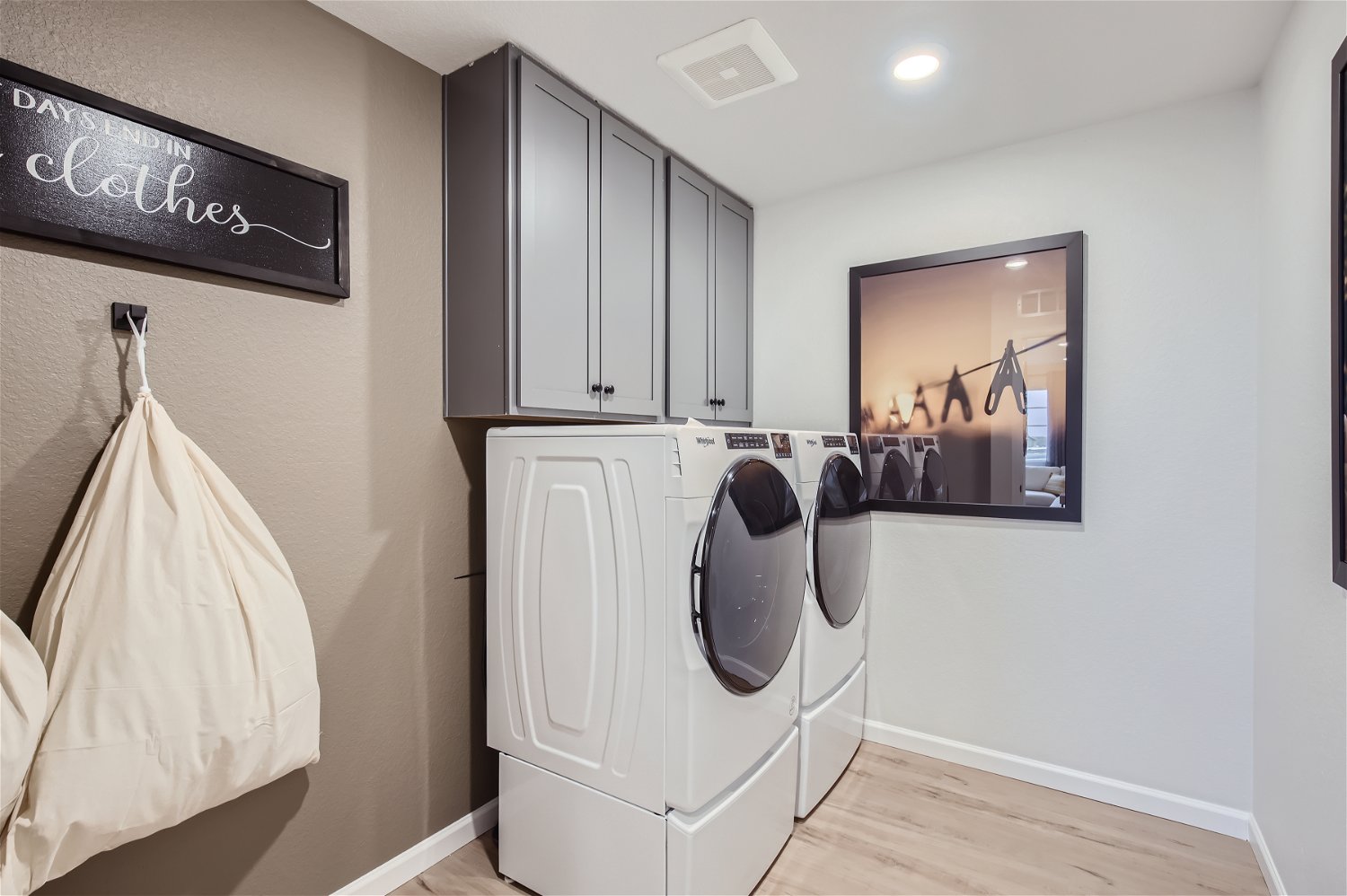 A laundry room with a washer and dryer.