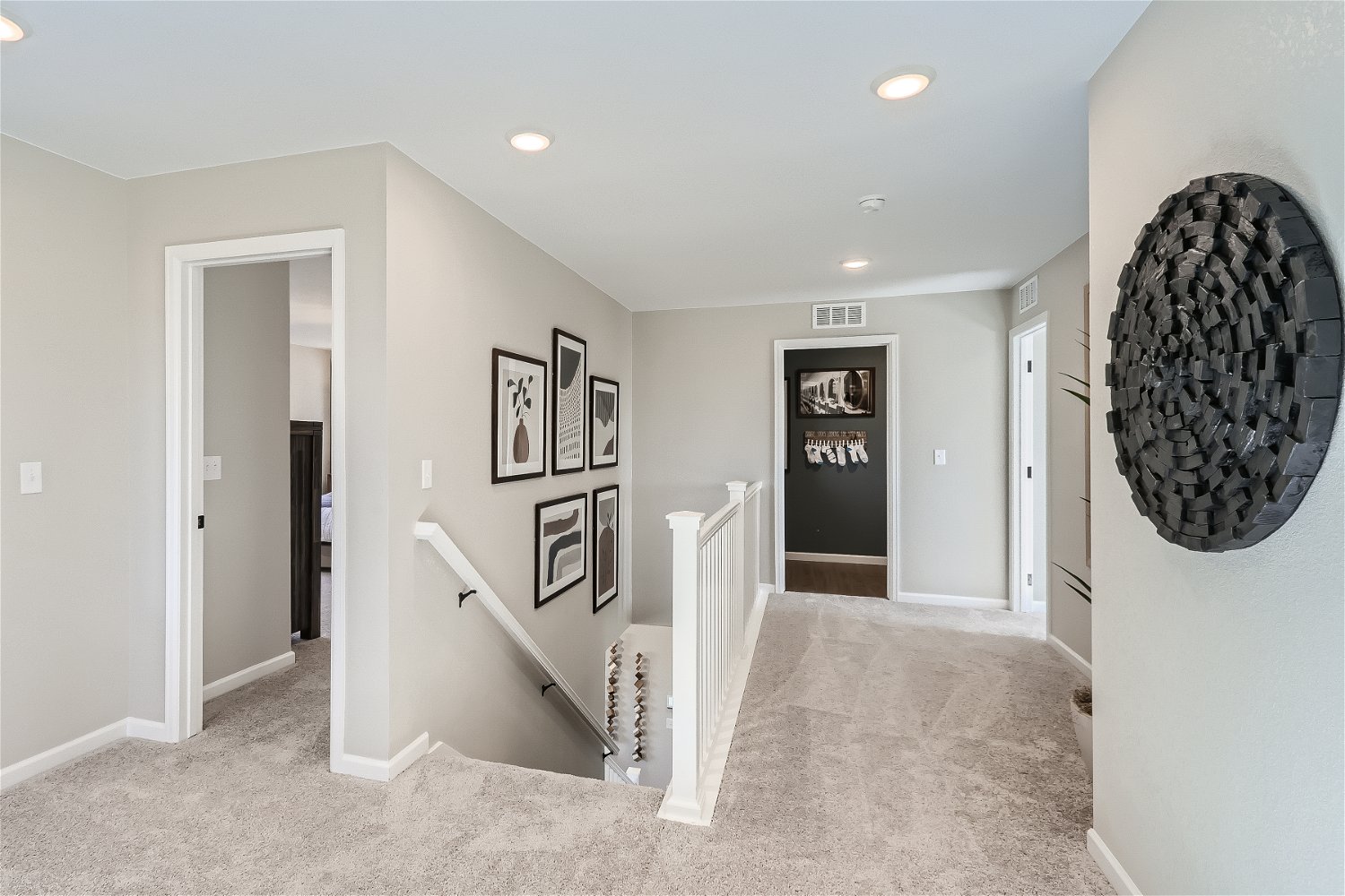A hallway with a fan.