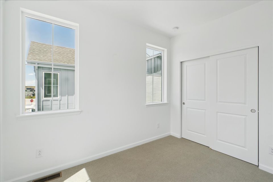 A room with white doors and windows.