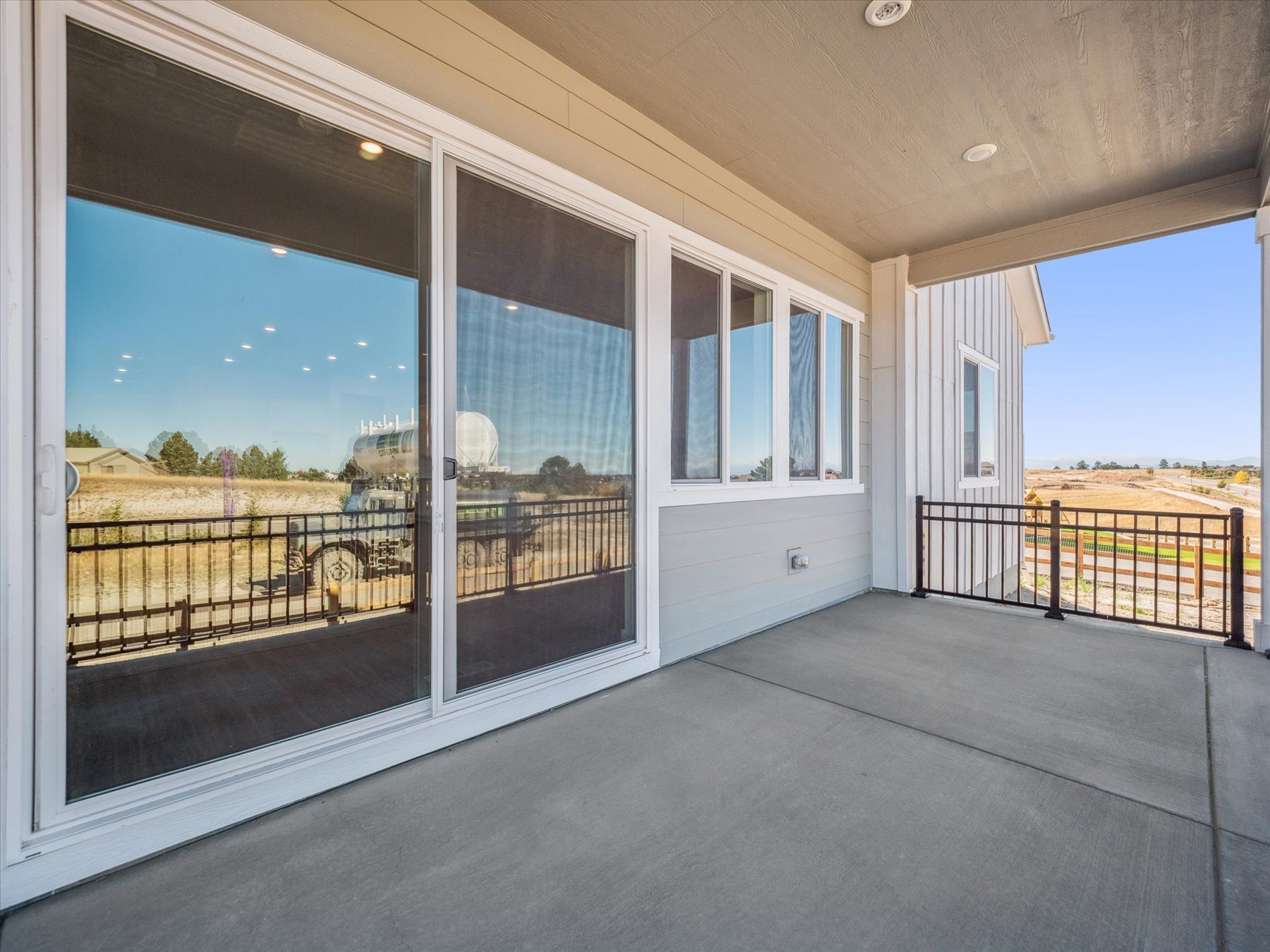A room with windows and a railing.