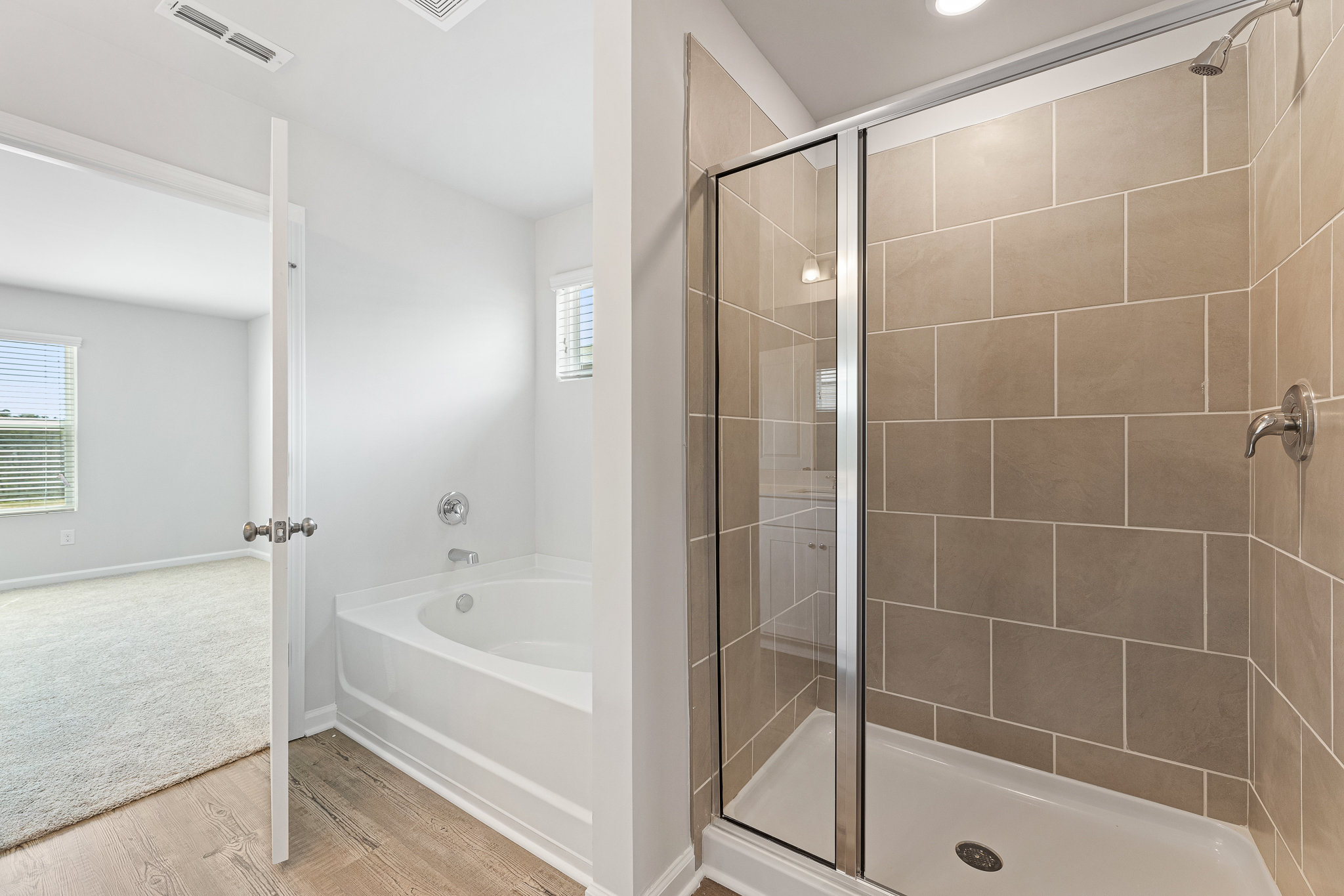 A bathroom with a glass shower.