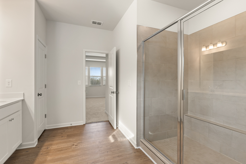 A bathroom with a glass shower.