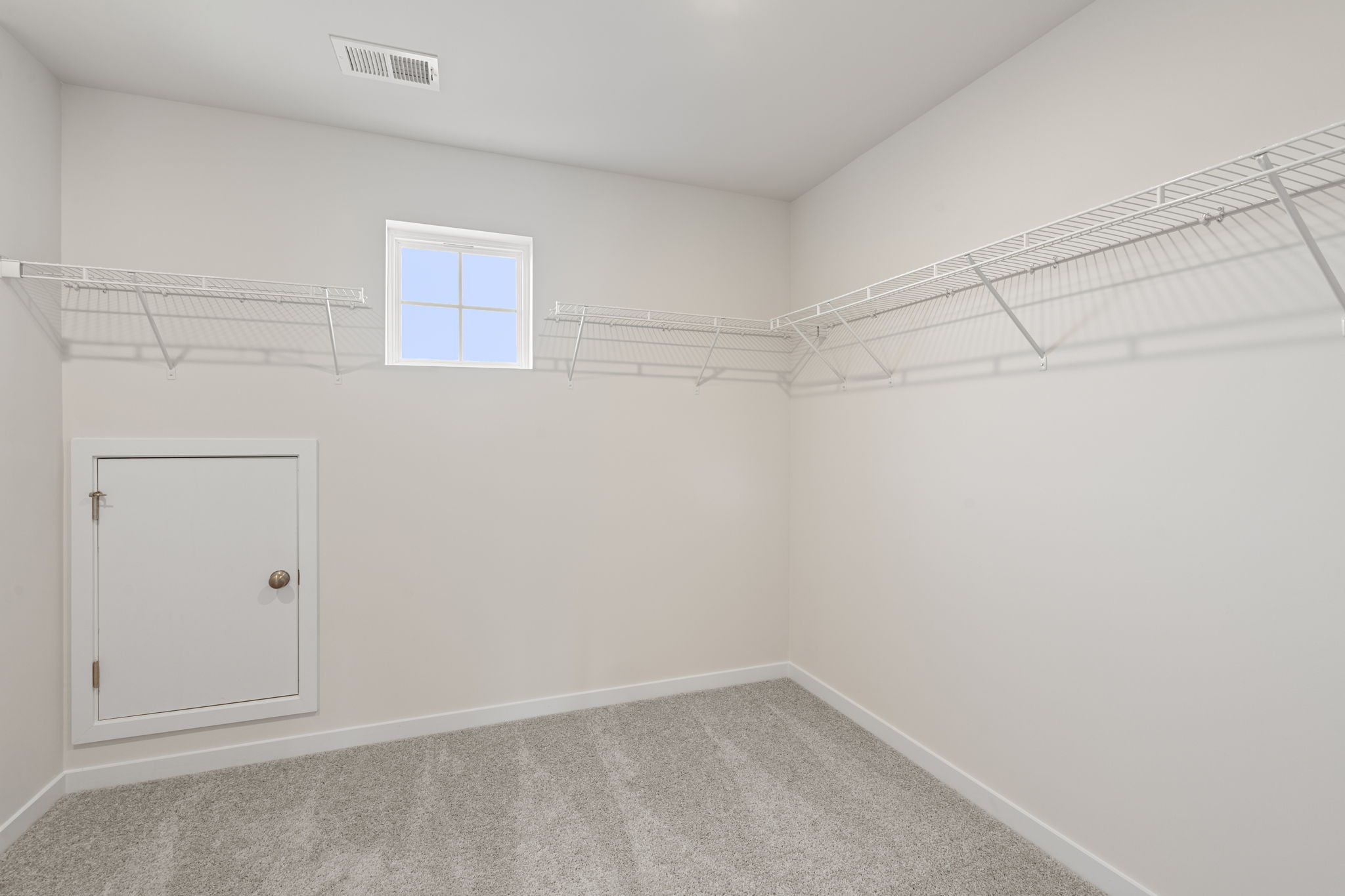 A room with a door and a window.