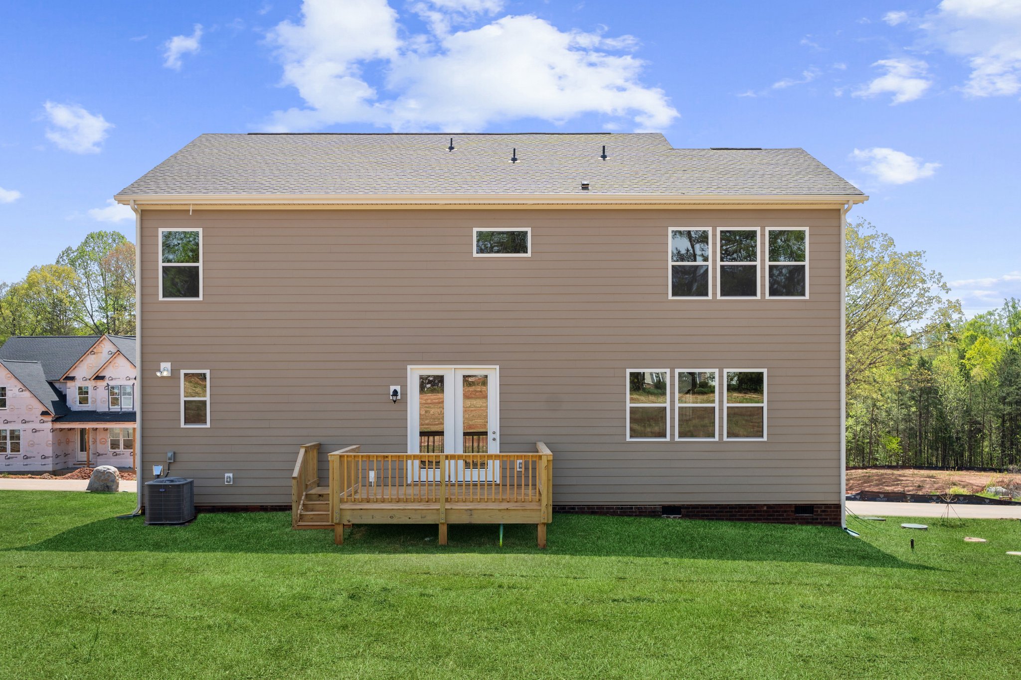 A house with a fence in the front.