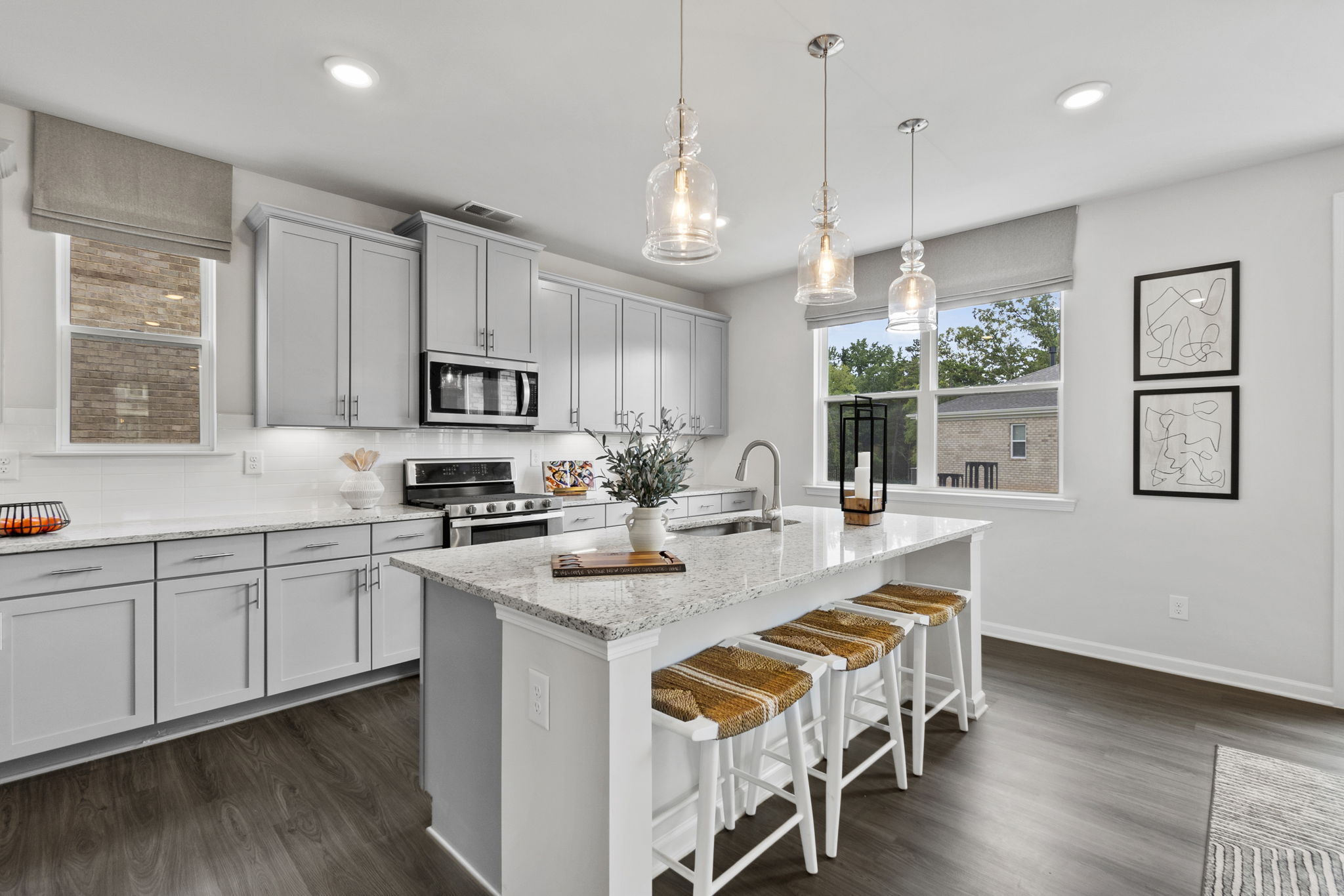 A kitchen with white cabinets.