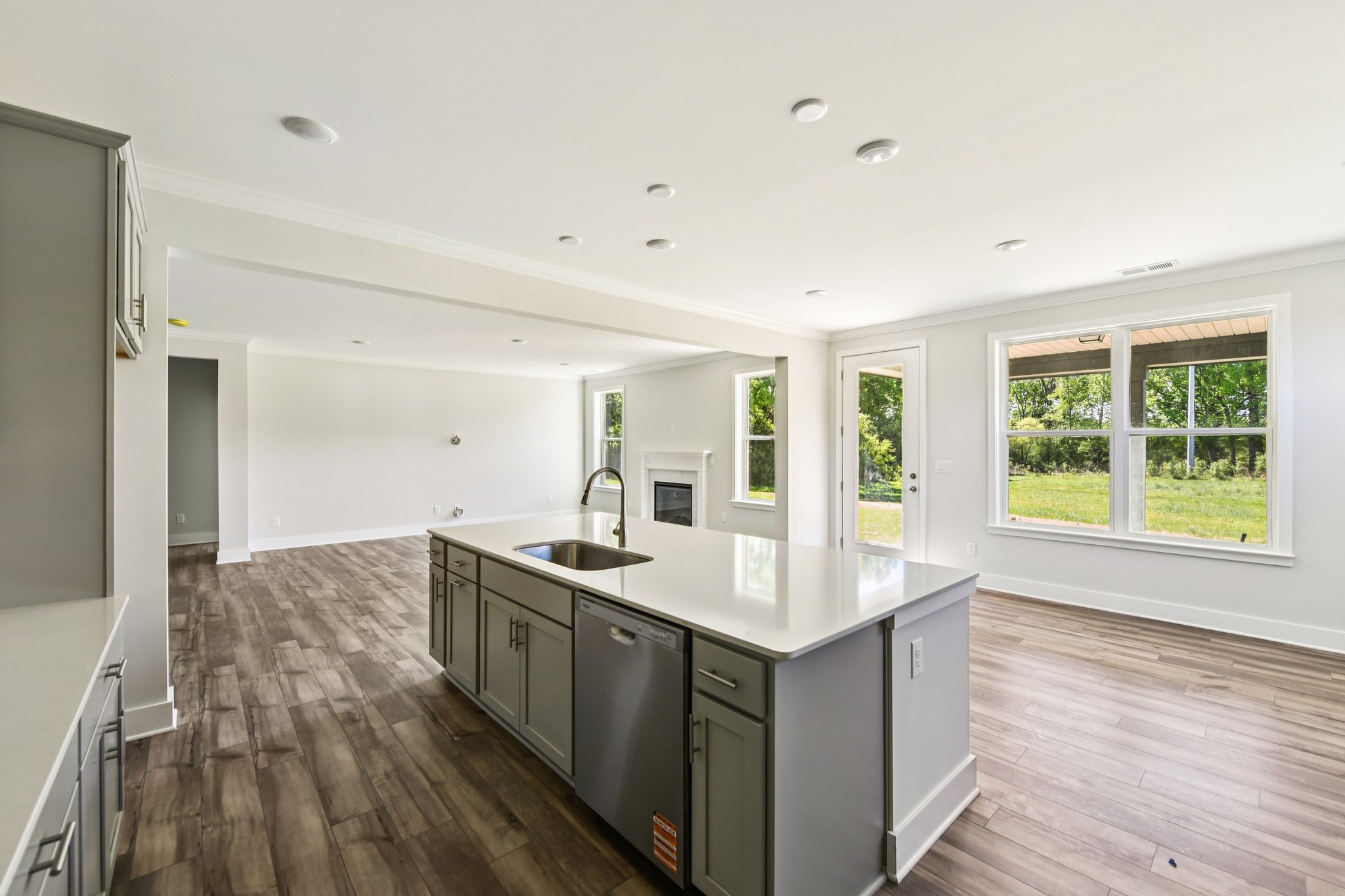 A kitchen with a wood floor.