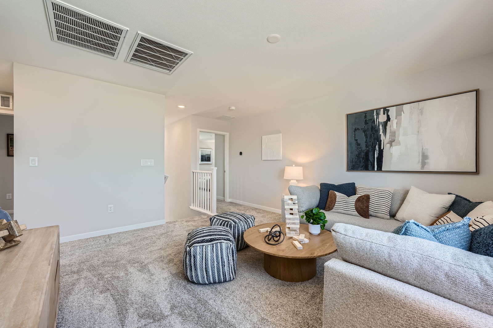 A living room with a couch and a coffee table.
