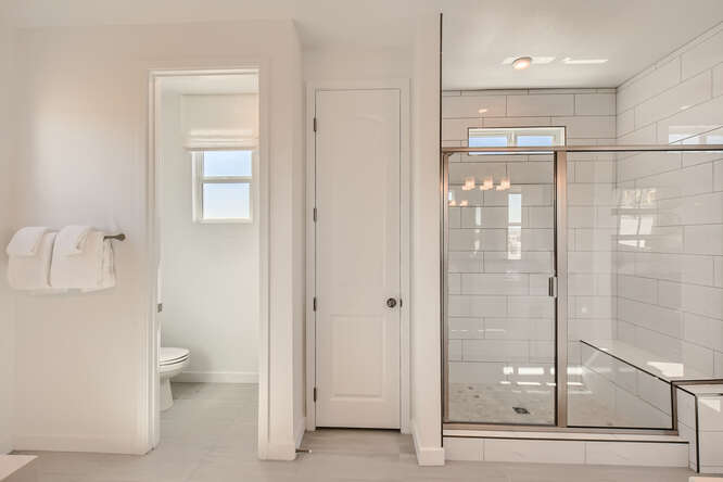 A bathroom with a glass shower.