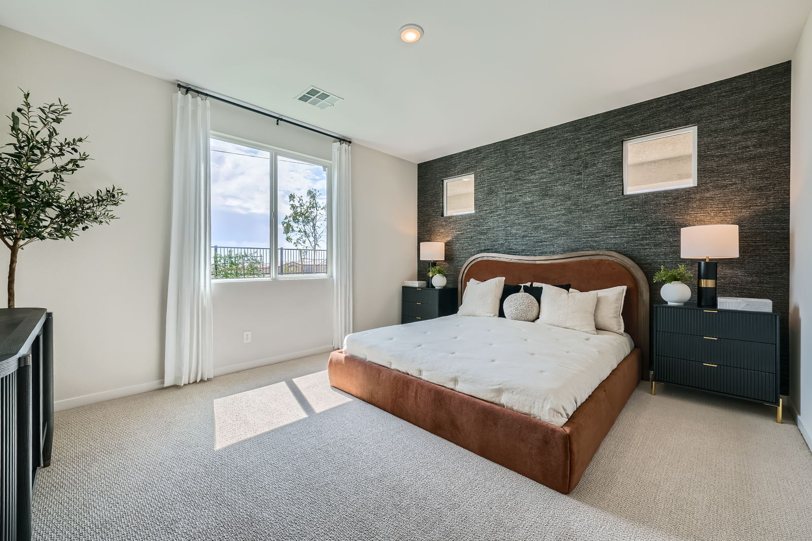 A bedroom with a large bed.