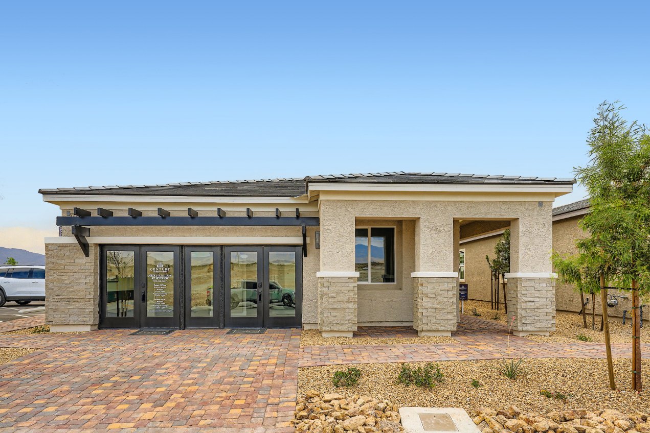 A building with a brick driveway.