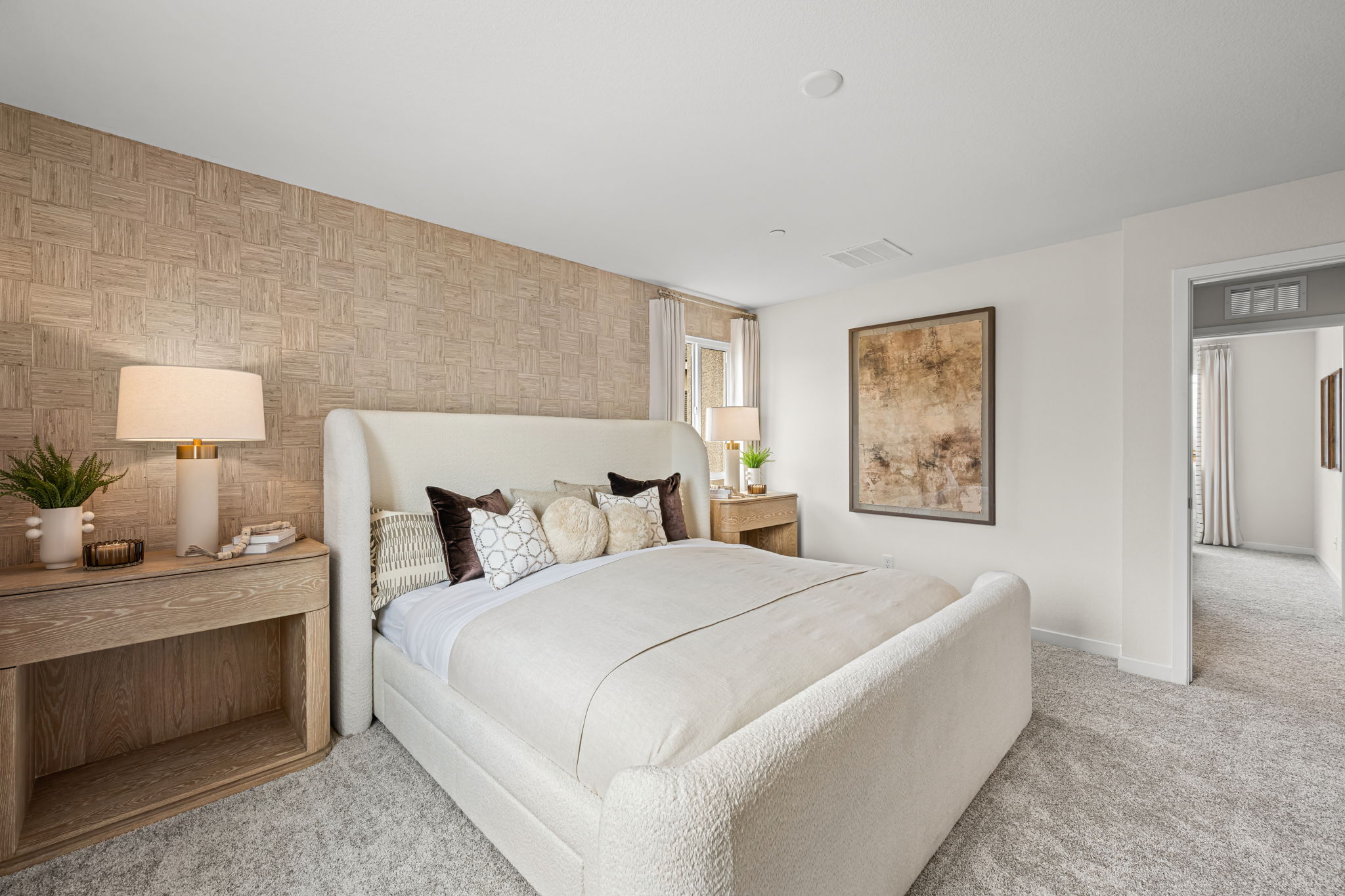 A bedroom with a bed and a couch.