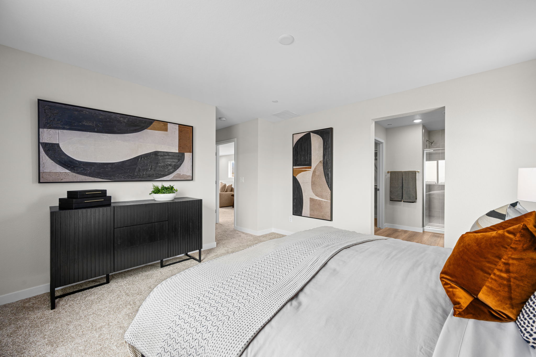 A bedroom with a bed and a tv.