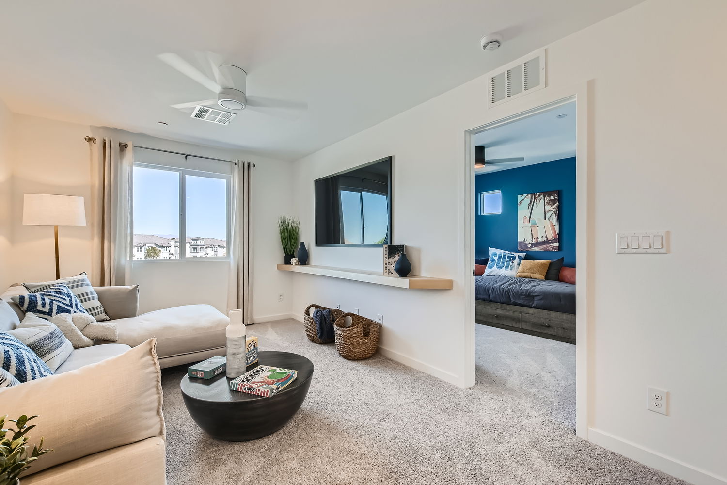 A living room with a tv and couches.