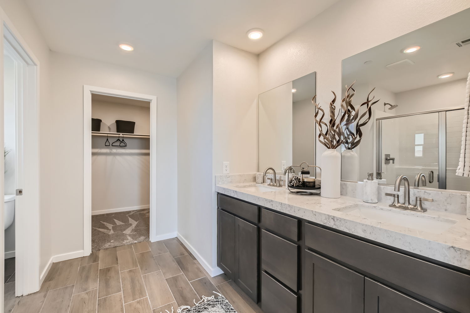 A bathroom with a marble countertop.
