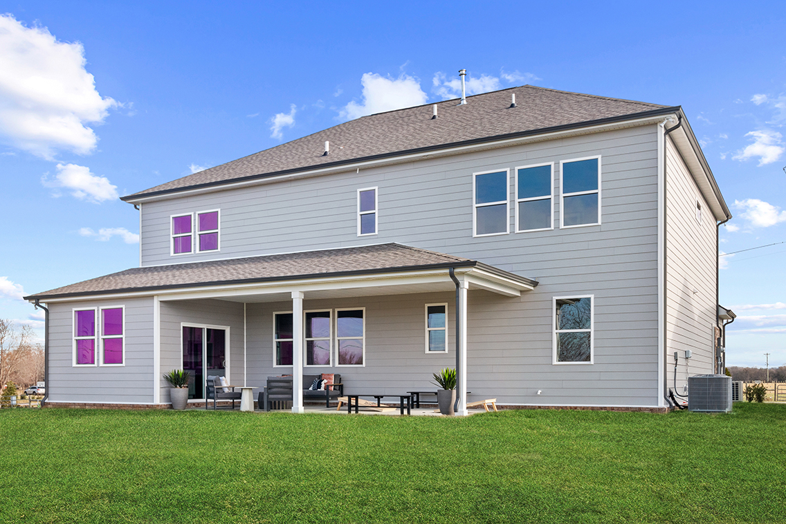 A house with a lawn in front.