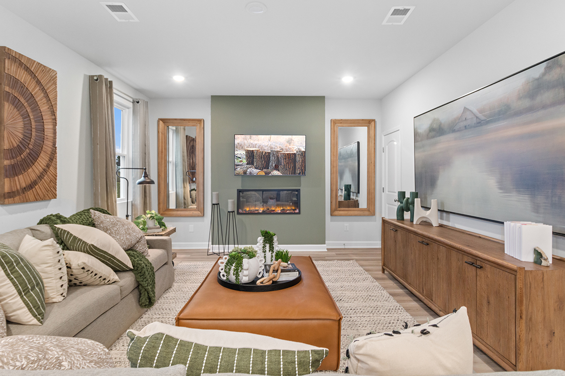 A living room with a large tv.