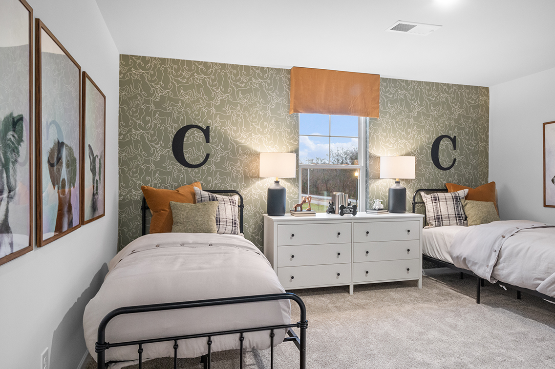 A bedroom with two beds.