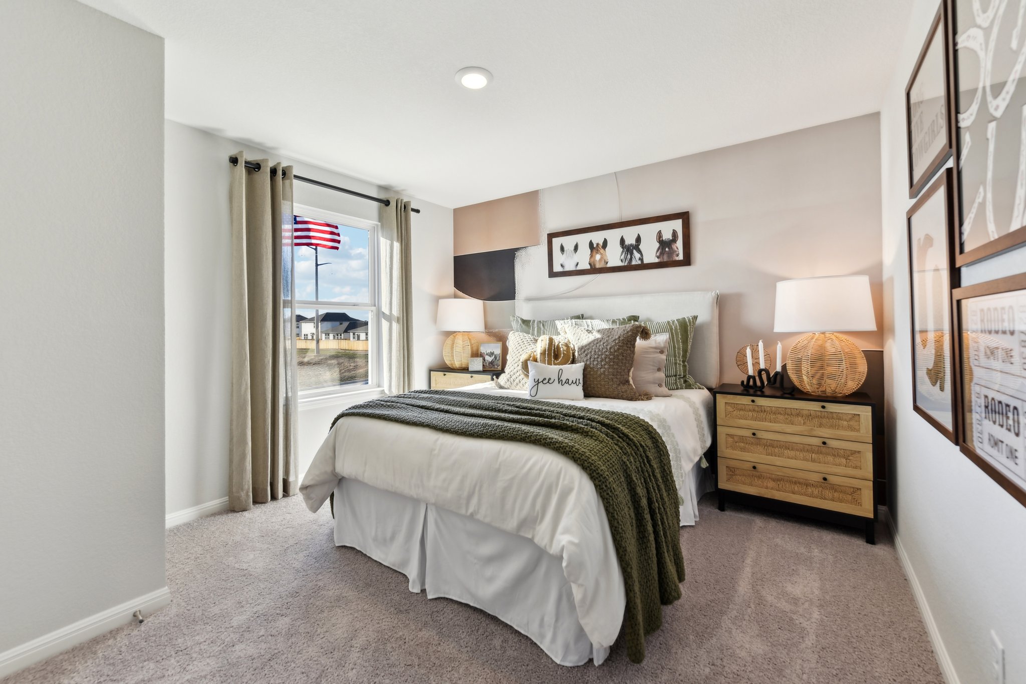 A bedroom with a bed and lamps.