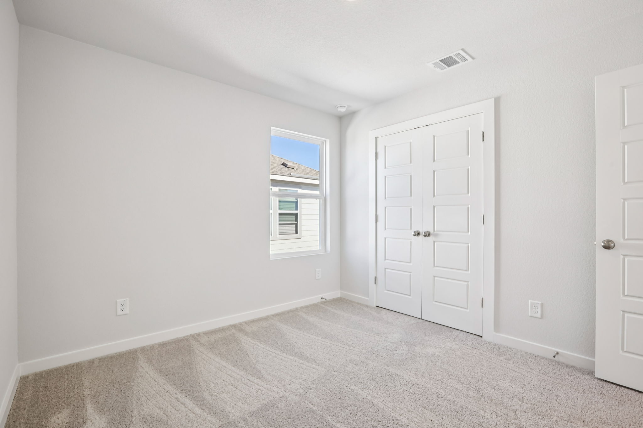 A room with white doors.