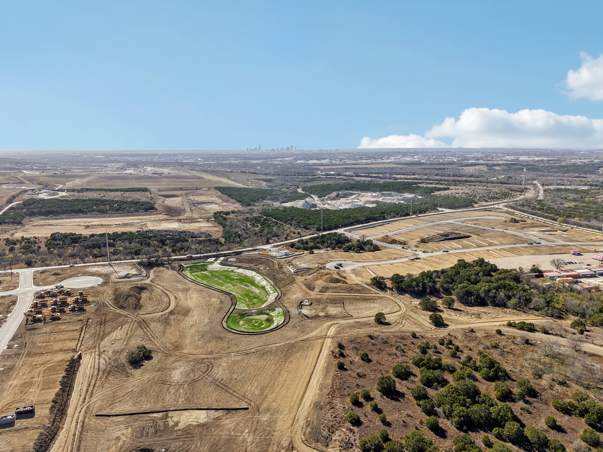 A landscape with trees and grass.