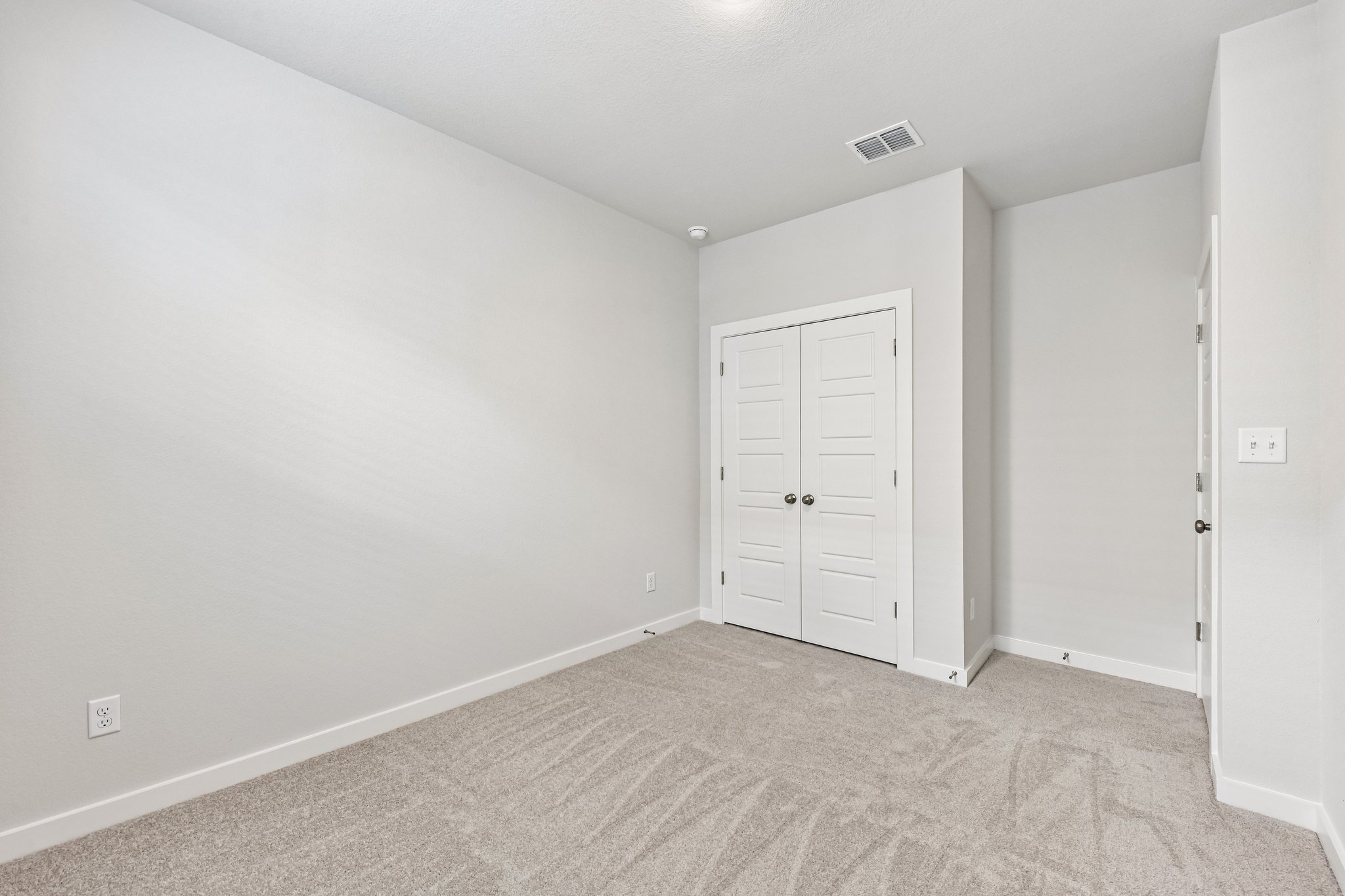 A room with white doors.