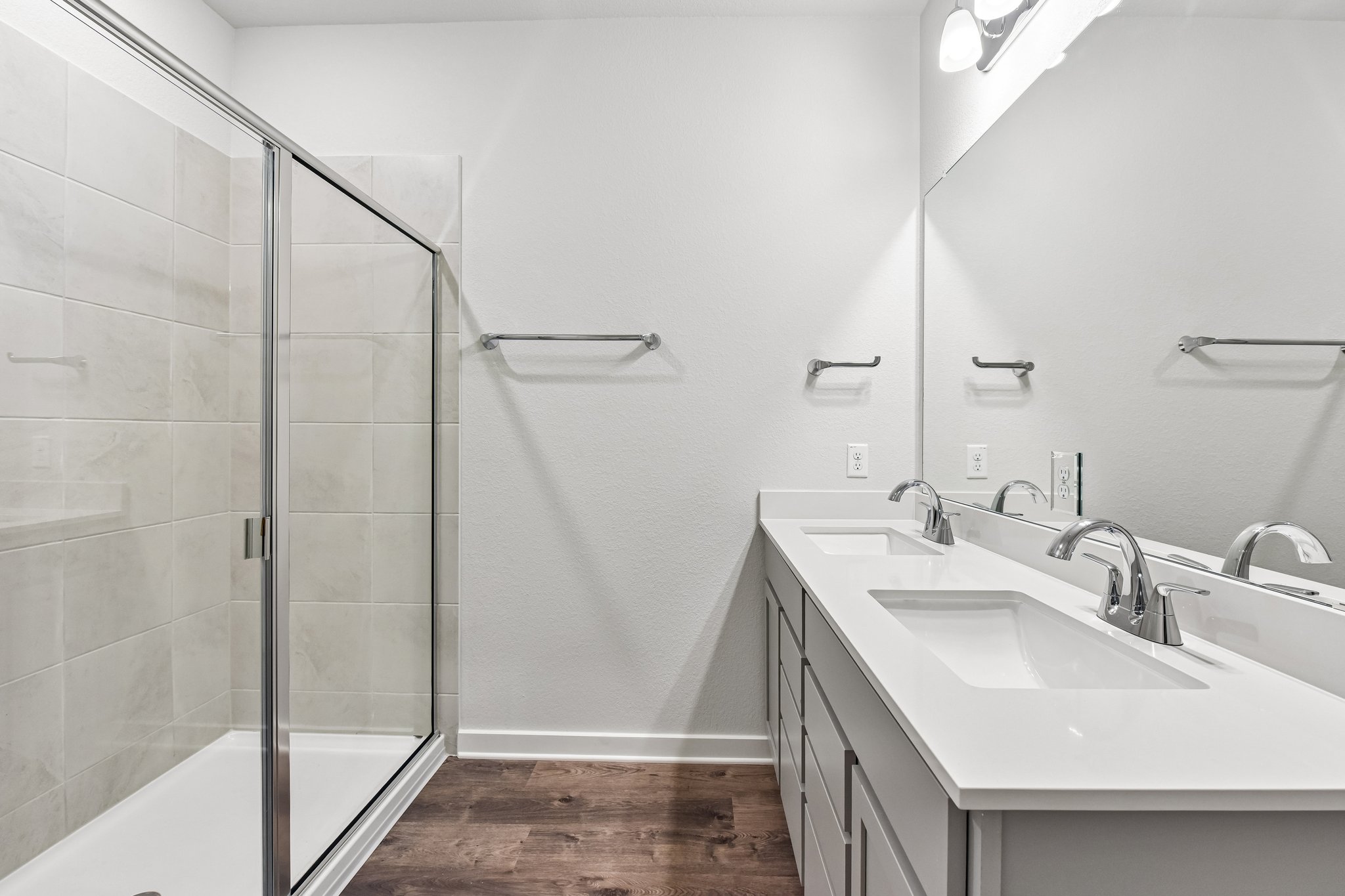 A bathroom with a glass shower.